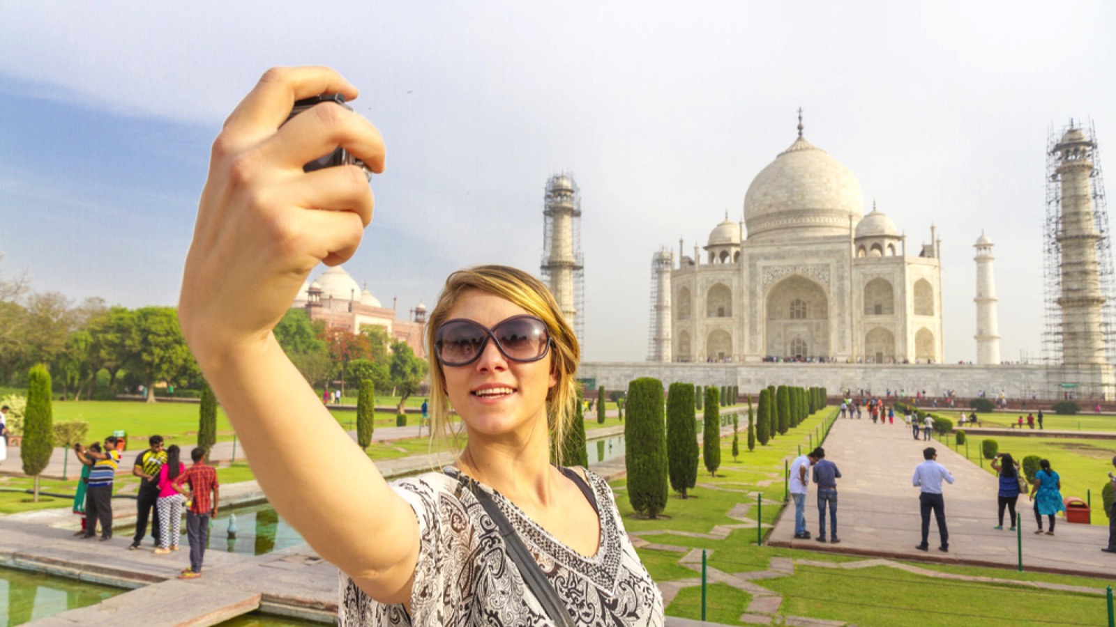 Woman taking selfie in Taj Mahal
