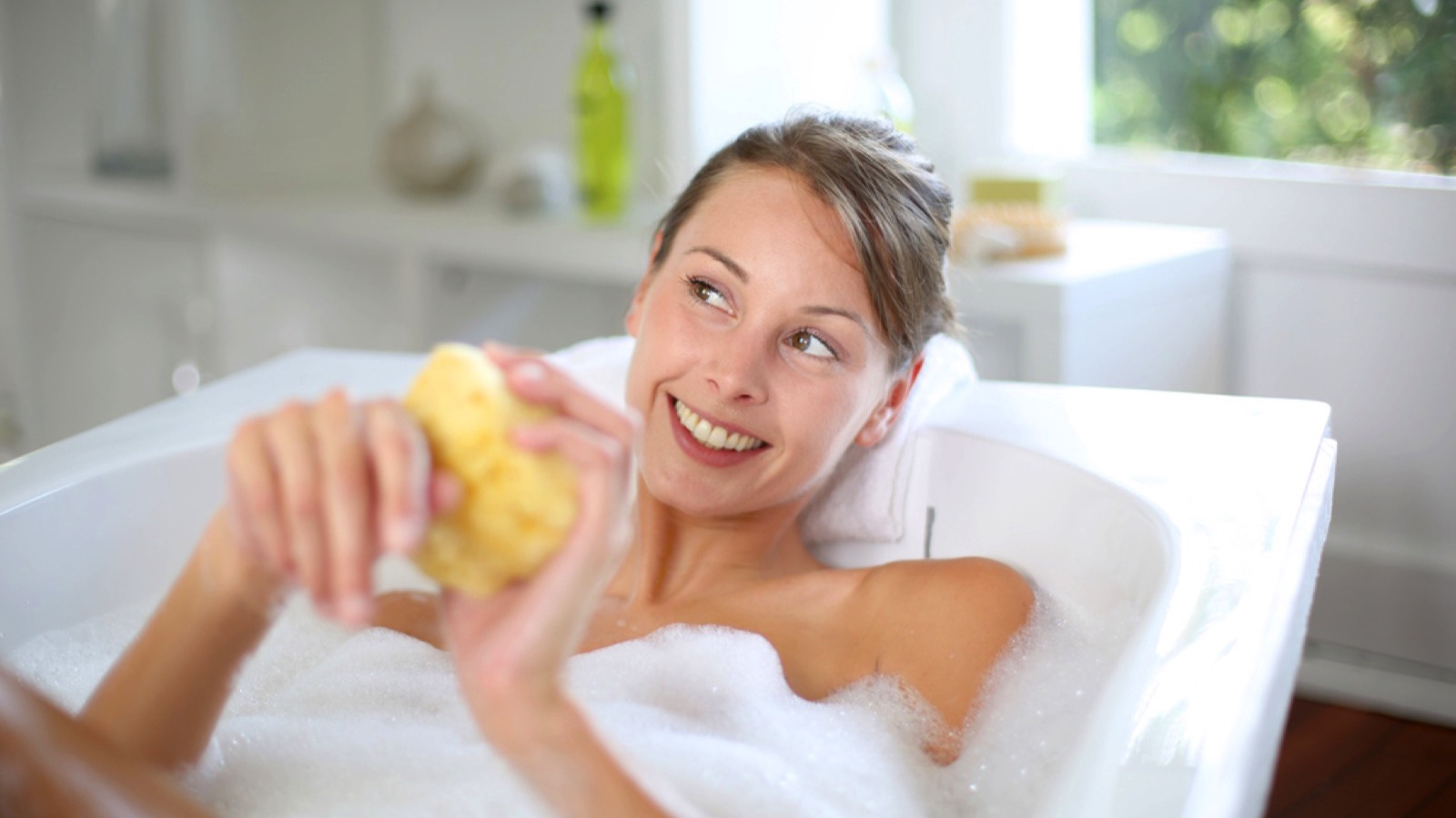Woman using bath soap