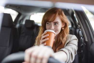 coffee in the car woman